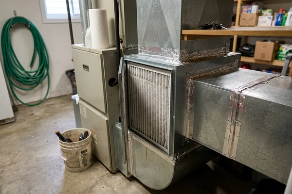 Media air cleaner installed in return ductwork