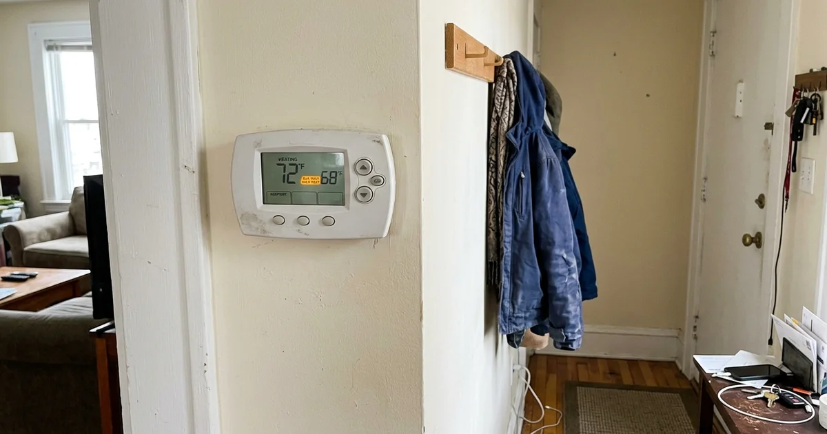 Thermostat displaying the auxiliary heat indicator